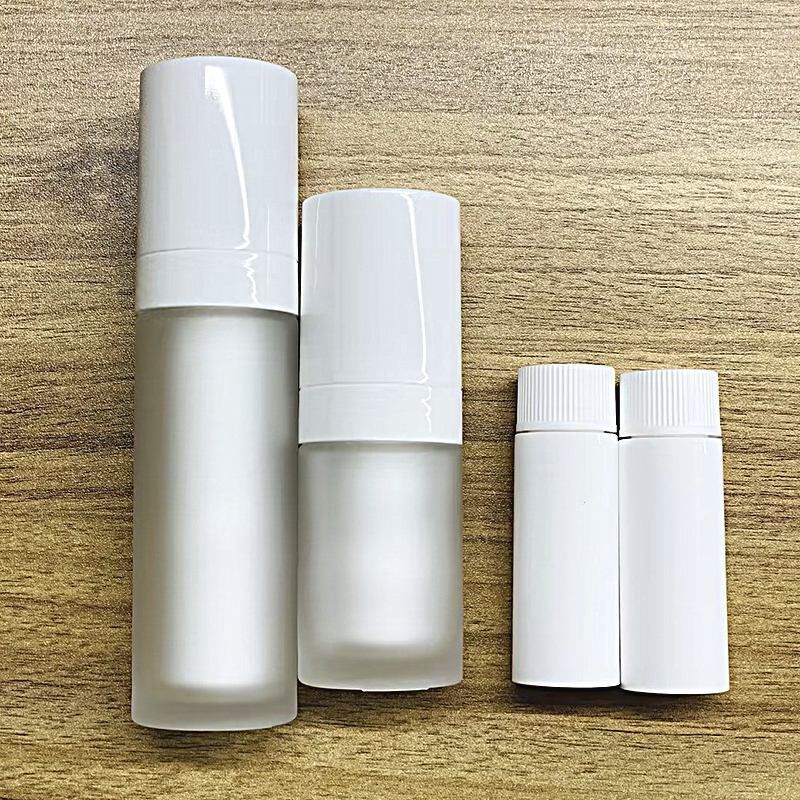 Custom made your logo High-end Substitutable Eco friendly Packaging Glass Bottle and Jar Cylinder Reusable Glass Airless Bottle